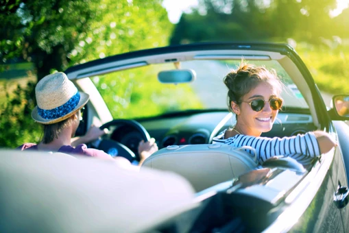 Zenus Bank Women Looking Back From Car