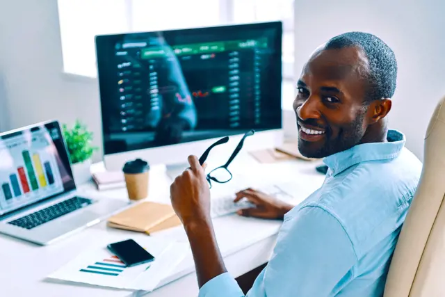 Zenus Bank Man Sitting At Desk