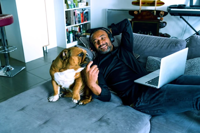 Zenus Bank Man Relaxing With Dog