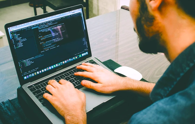 Zenus Bank Man Coding On Laptop