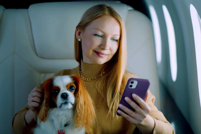 Zenus Bank Women On Plane With Dog